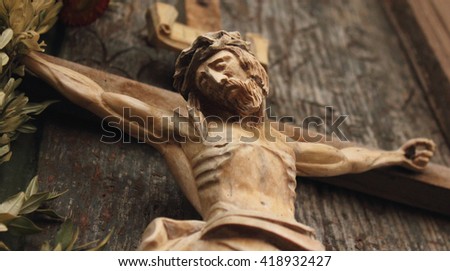 Jesus Christ crucified (an ancient wooden sculpture)  Royalty-Free Stock Photo #418932427