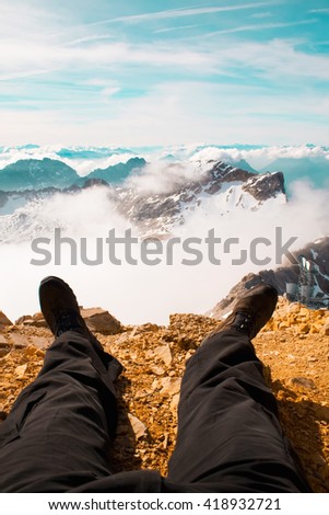 Picture of a walkers legs with a beautiful back drop of the Austrian Alps