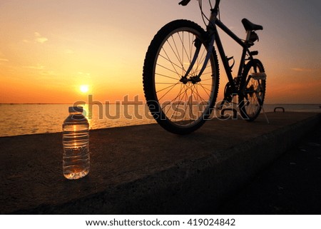 Low key picture : Drinking fresh water after exercise. Low lighting when twilight time.
