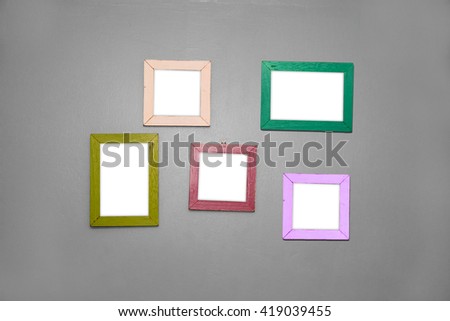 5 Empty vintage frame isolated on gray cement wall.