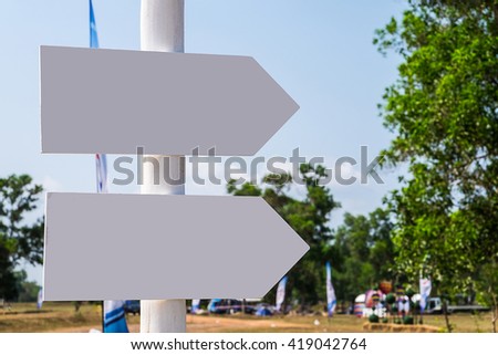 White arrow sign