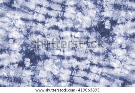 tie dyed pattern on cotton fabric background.

