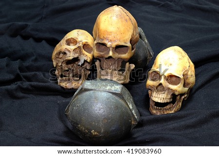 human skulls and Heavy black dumbbells on black background. concept still life style and workout
