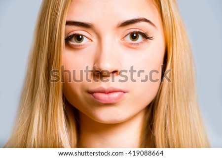 Portrait of a beautiful blonde girl, closeup isolated on white background
