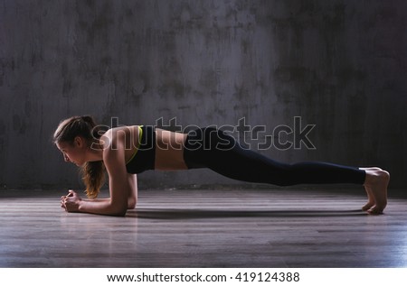 Sport woman posing in photostudio. Fitness motivation picture