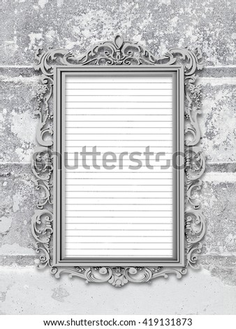 Close-up of one blank silver Baroque picture frame with stripes paper sheet frame on grey weathered brick wall background