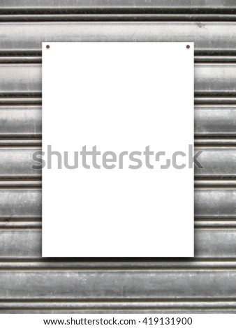 Close-up of one nailed blank frame on gray metal shutter background