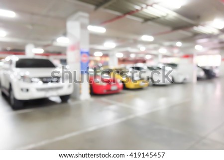 Blur image of car in parking lot.