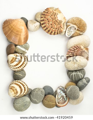 Full frame of river stones colored with sea shells