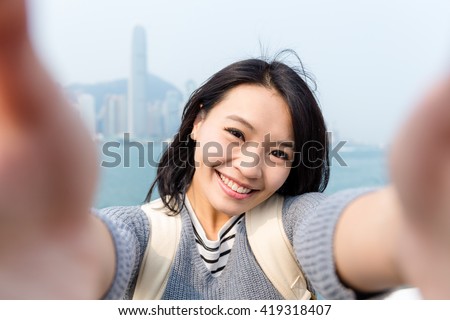 Woman taking the selfie in Hong Kong