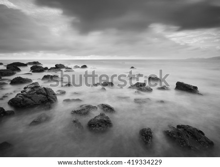 Beautiful long exposure shot of seascape in black and white. Soft focus due to long exposure shot. Nature composition.