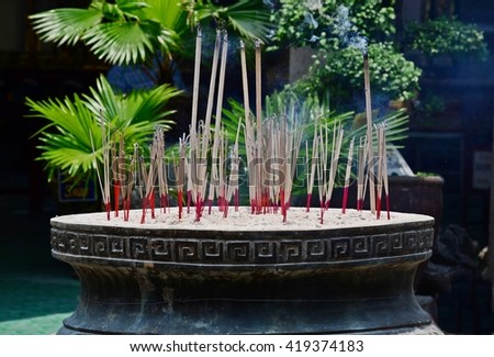 close up of joss sticks in pot,  incense in censer, worship, holy, smoke