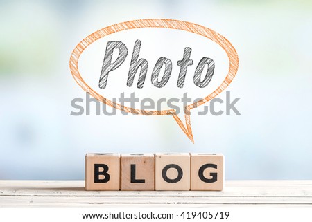 Photography blogger sign on a wooden table with text in a sketch
