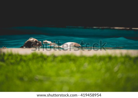 Pregnant woman at the swimming pool