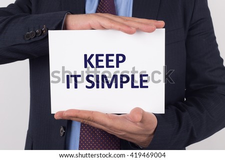 Man showing paper with KEEP IT SIMPLE text