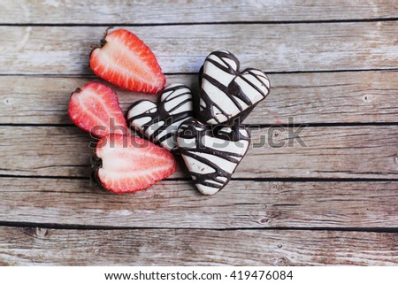 Love strawberries. Strawberries and chocolate. Cookies in the shape of heart. Heart shaped cookies. 