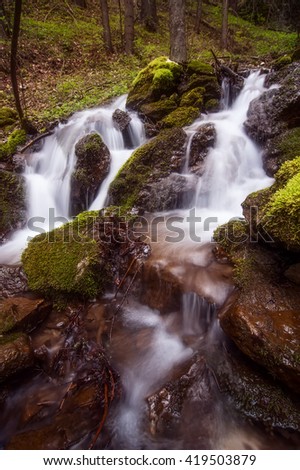 beautiful waterfall in the deep forest. natural background. picture with soft focus and long exposure