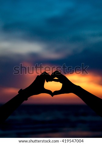 Silhouette in love on the sunset background . Valentine's Day concept.