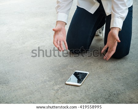 Felling Sad Person Drop Smartphone on Floor with Copy Space Royalty-Free Stock Photo #419558995