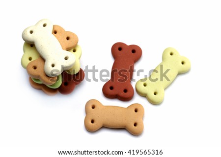Dog food , Pile of dog biscuits in the shape of a bone for pet food, in square frame shape for background use. Royalty-Free Stock Photo #419565316