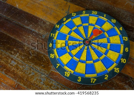 selective focus of old  target with arrows on the wood  background.