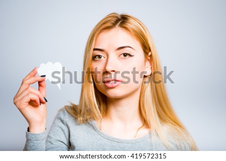 Pretty blond girl holding a sticker with the idea to insert text