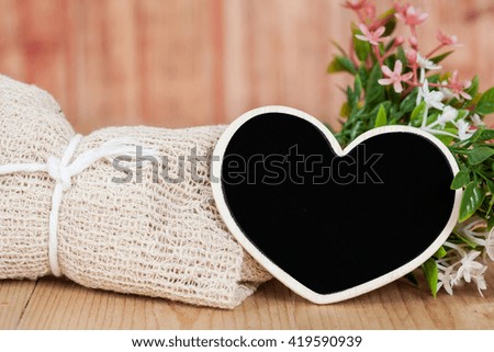 Bouquet of dried flowers with wooden heart shape
