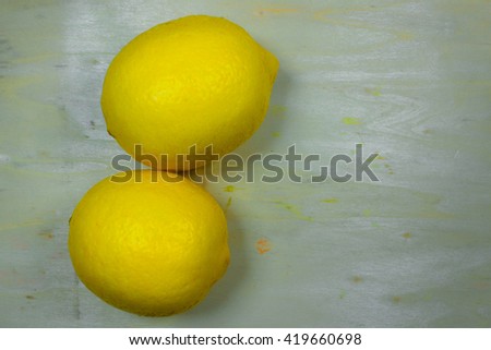 Freshly lemons on rustic boards.
