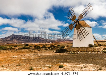 Traditional Windmill With Mountain In The Background - Fuerteventura, Canary Islands, Spain