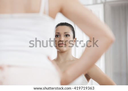 Ballerina Practicing In Front Of Mirror