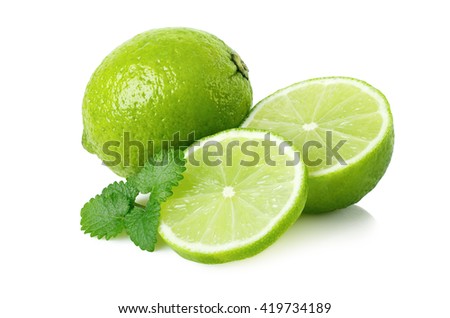 Ripe lime with a half and melissa on white background