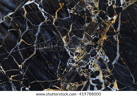 Gold and white patterned structure of dark gray marble texture for design. Royalty-Free Stock Photo #419788000