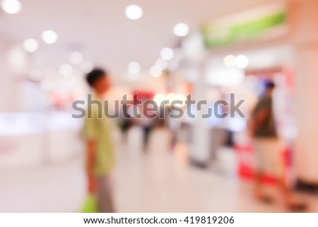 blur background image of people in Shopping mall.