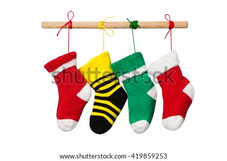 Stocking christmas socks. isolated on white background. Colorful xmas design decoration photography. red, yellow, green hanging knitted sock. Wooden plank and colored ropes