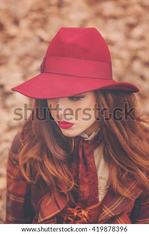 Closeup portraits of a beautiful Jewish girl in a pink hat in a retro style with a professional makeup and bright lipstick, emotions, smile, vintage
