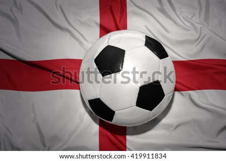 vintage black and white football ball on the national flag of england