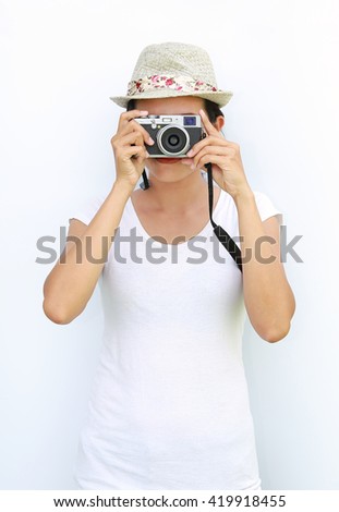Asian women wear T-Shirt and hat was being photographed