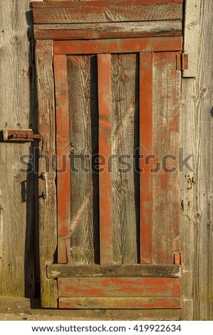 old wooden door with a metal handle