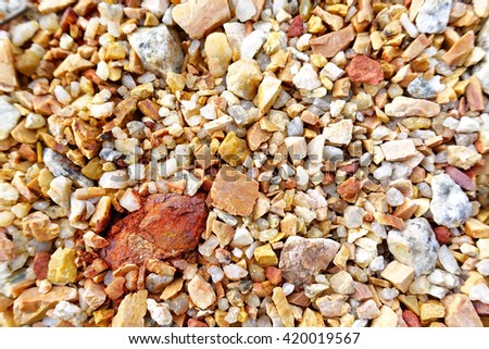 Colored little stone and gravel background,select focus with shallow depth of field,Ideal use for background.