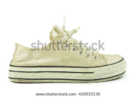 Old sneakers on a white background.
