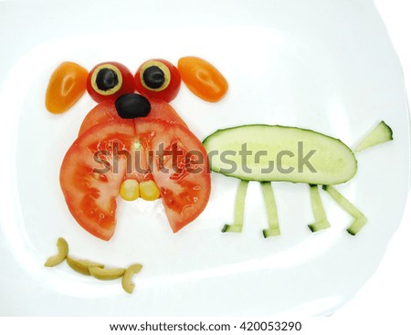 creative funny vegetable food snack with tomato dog form