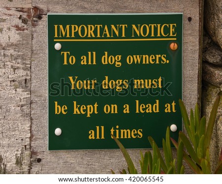 "Important Notice, To All Dog Owners, Your Dogs Must be Kept on a Lead at All Times" Sign on the Island of Tresco in the Isles of Scilly, England, UK