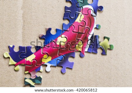 Pieces of puzzle, test skill put on paper background.