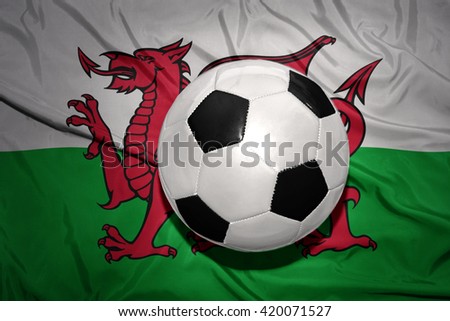  vintage black and white football ball on the national flag of wales