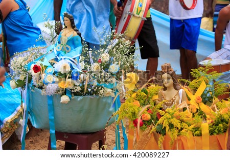 Statues of Yemanja goddess of the sea in an offering basket in Brazil
