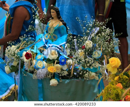 Statues of Yemanja goddess of the sea in a offering basket in Brazil