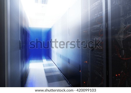room with rows of server hardware in the data center
