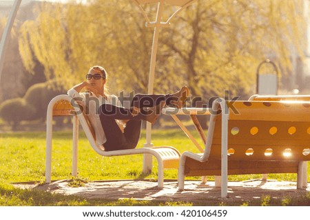 young woman relaxing  in the riverside on summer