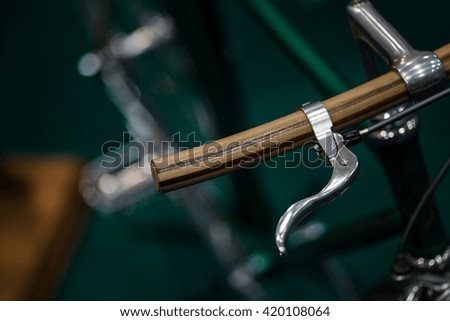 Color detail shot of the brake lever on a vintage bicycle.