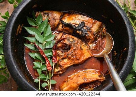 Spicy hot Kerala fish curry. Pearl spot /  Karimeen fish in South India, coastal area of Sri Lanka. Tilapia fish